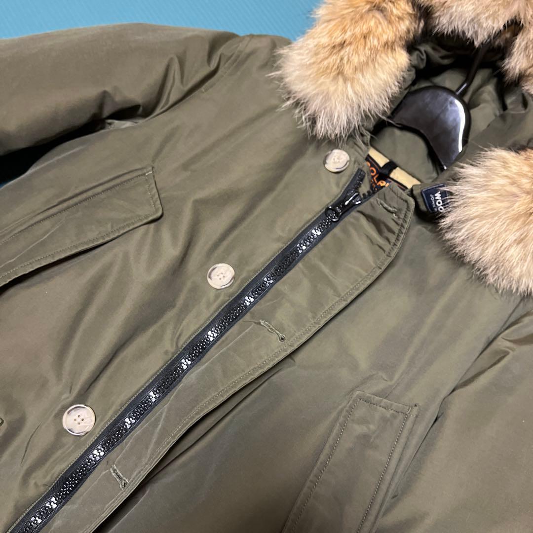 1/31まで。WOOLRICH オリーブ アークティックパーカー