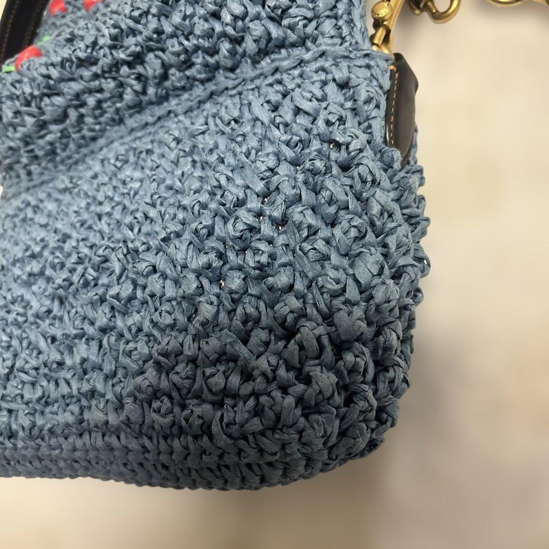 COACH チェリー柄ストロー素材ハンドバッグ