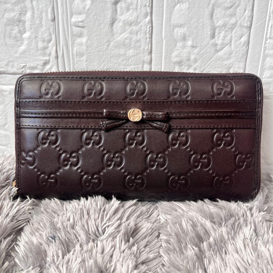 美品✨GUCCI ラウンドファスナー　シマ　リボン　ブラウン　長財布　レディース