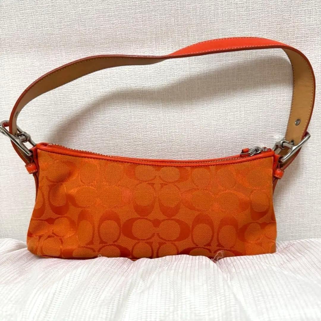 COACH アクセサリーポーチ　ワンショルダー　シグネチャー　オレンジ