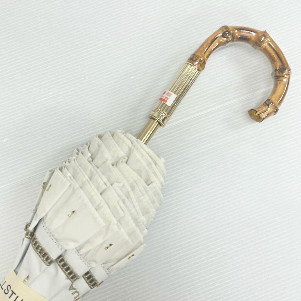 は*な様 新品52983ジルスチュアート＊オフホワイトフリル晴雨兼用折りたたみ日
