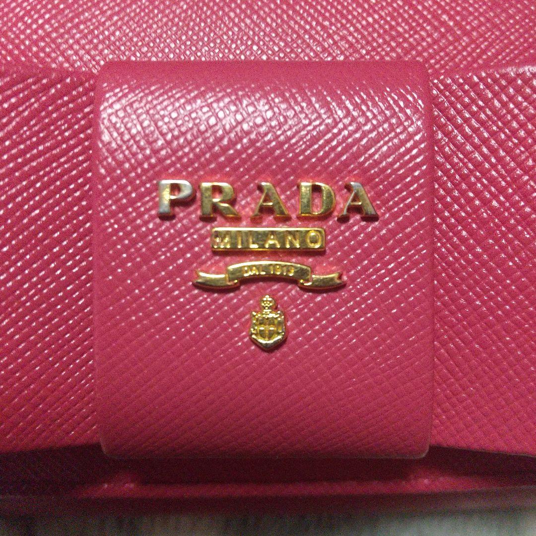PRADAサフィアーノ レザーリボン付き 長財布 レッド系