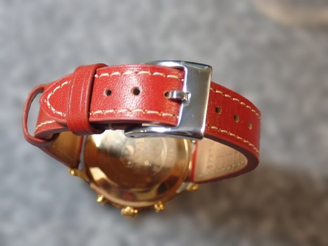 ●SWAROVSKI●グリーンフェイスクロノグラフ●赤のレザーベルト●美品稼 働