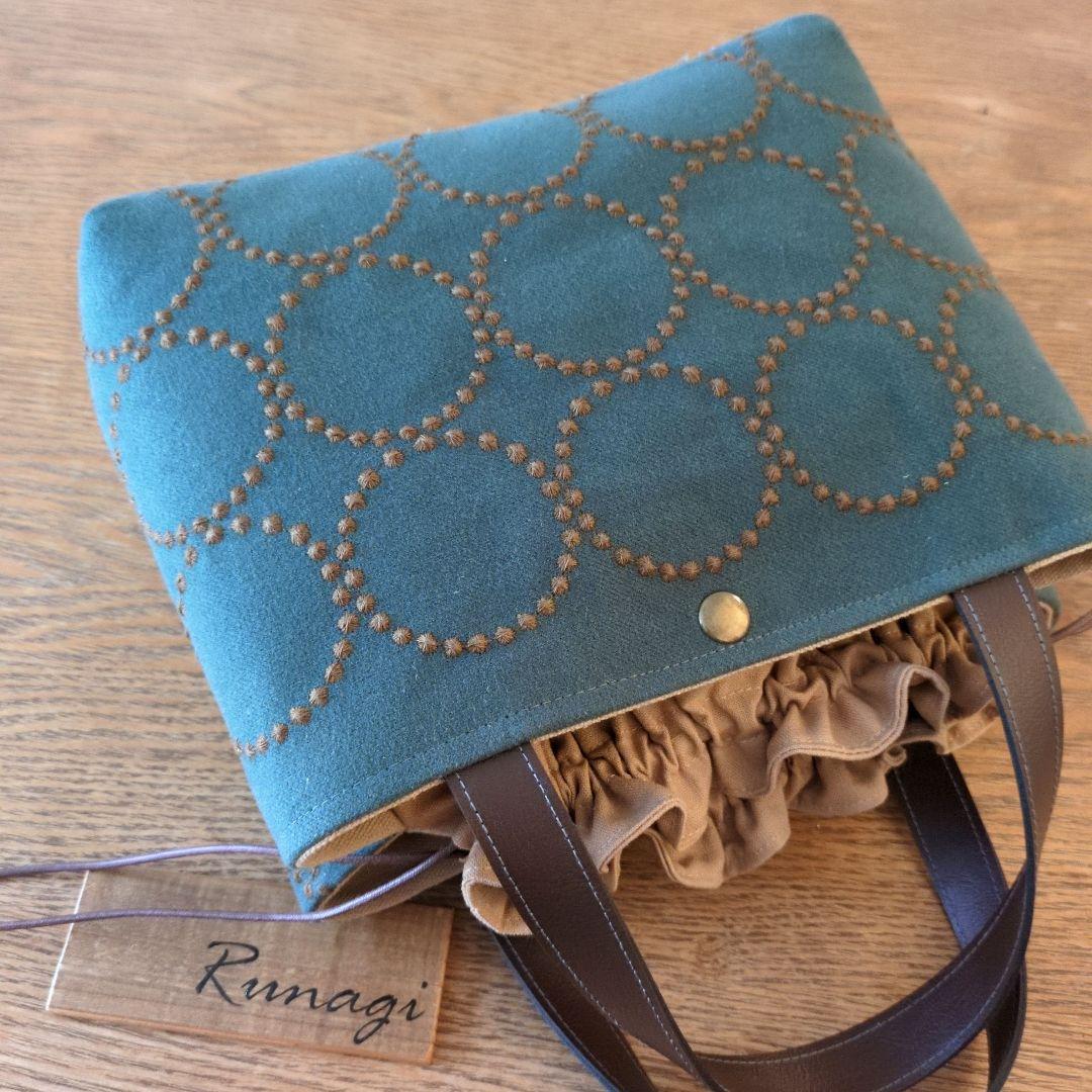 あおりポケットの巾着バッグ＊ミナペルホネン