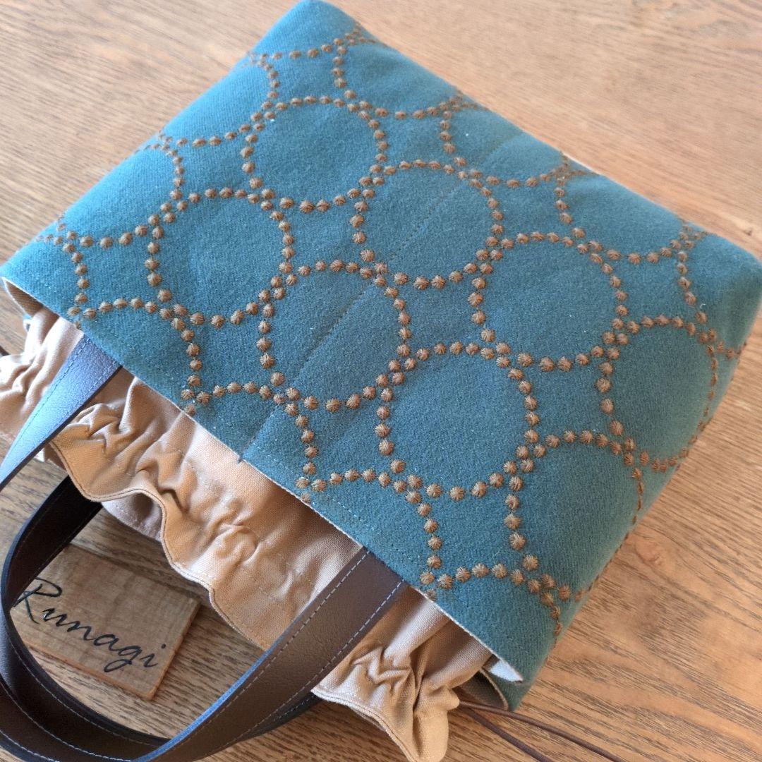 あおりポケットの巾着バッグ＊ミナペルホネン