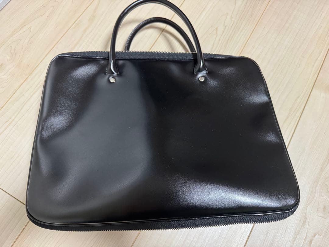 COMME des GARÇONS ブラックレザーハンドバッグ