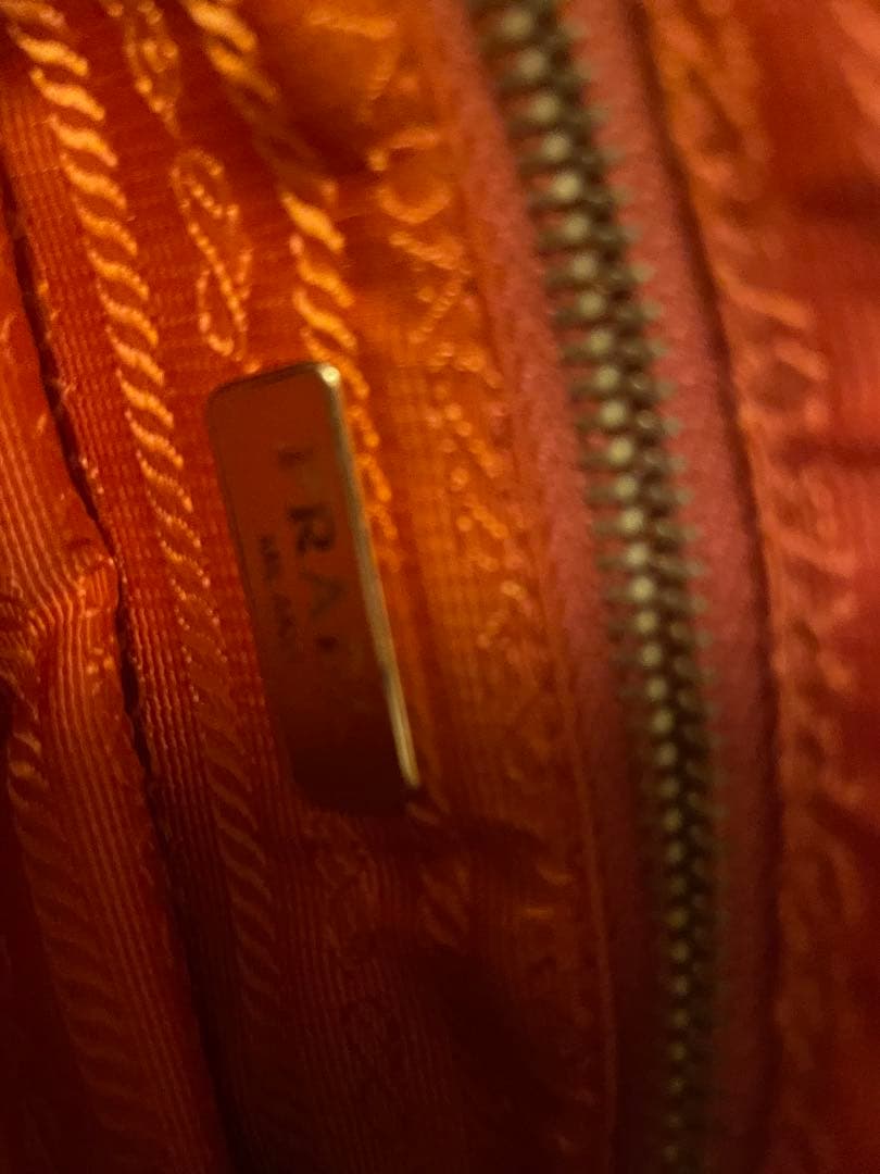 PRADA オレンジ クラッチバッグ