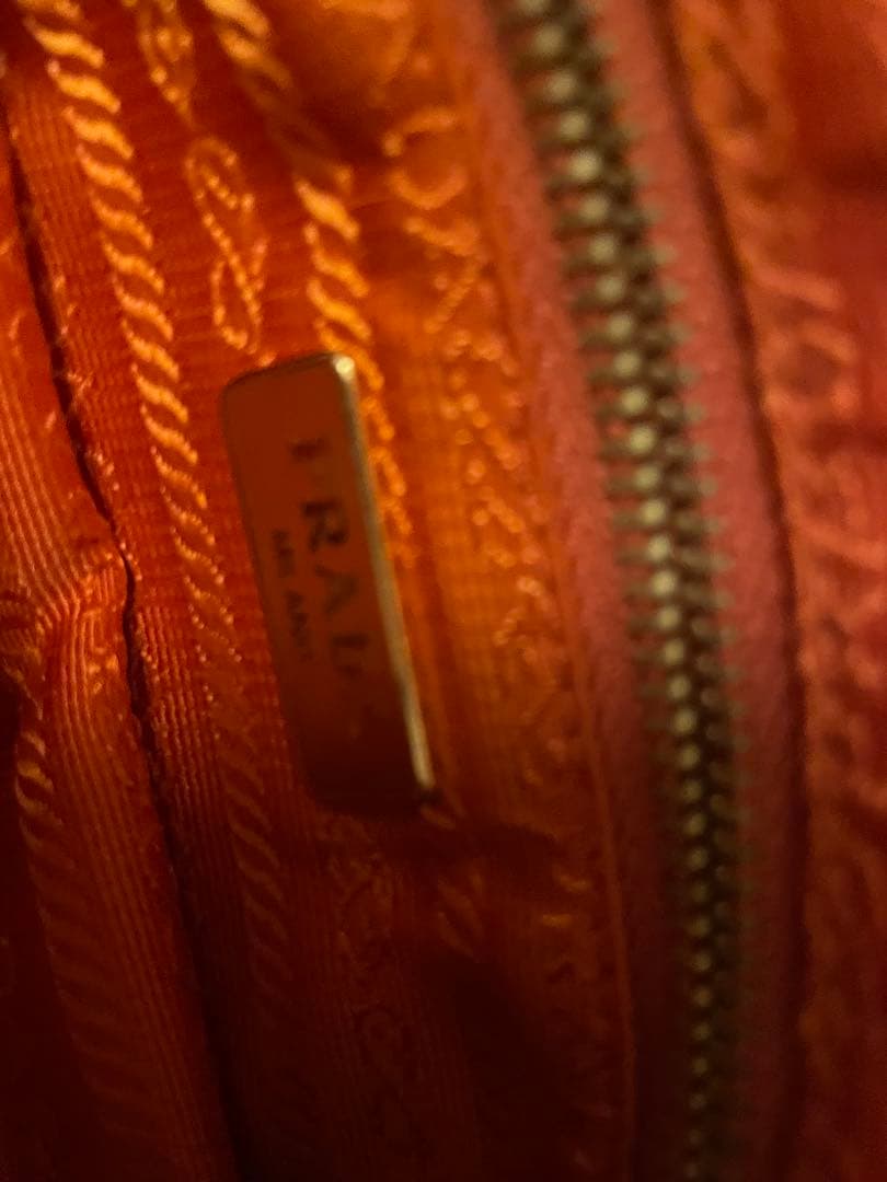 PRADA オレンジ クラッチバッグ