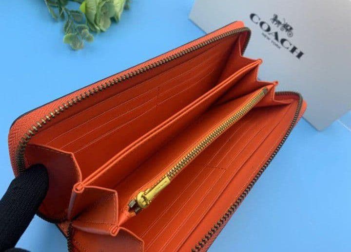 新品未使用コーチ長財布オレンジロングジップレディースメンズ送料無料即日発送