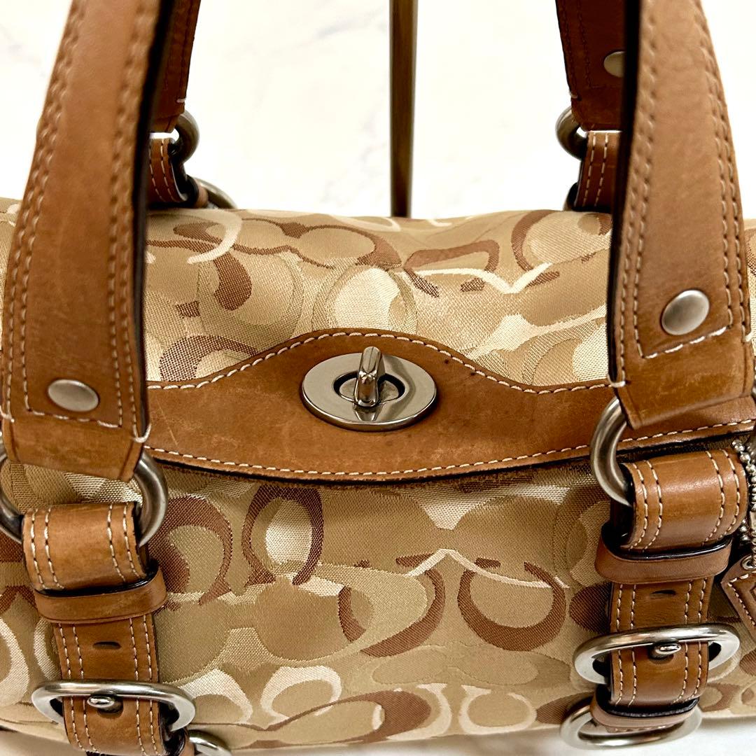 美品 コーチ ハンドバッグ シグネチャー チャーム付 レザー本革 ターンロック