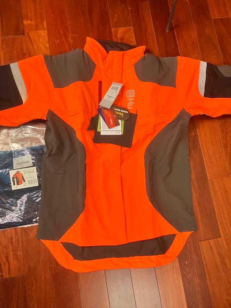 新品　Husqvarna テクニカルジャケットLサイズ オレンジ　おまけ付き
