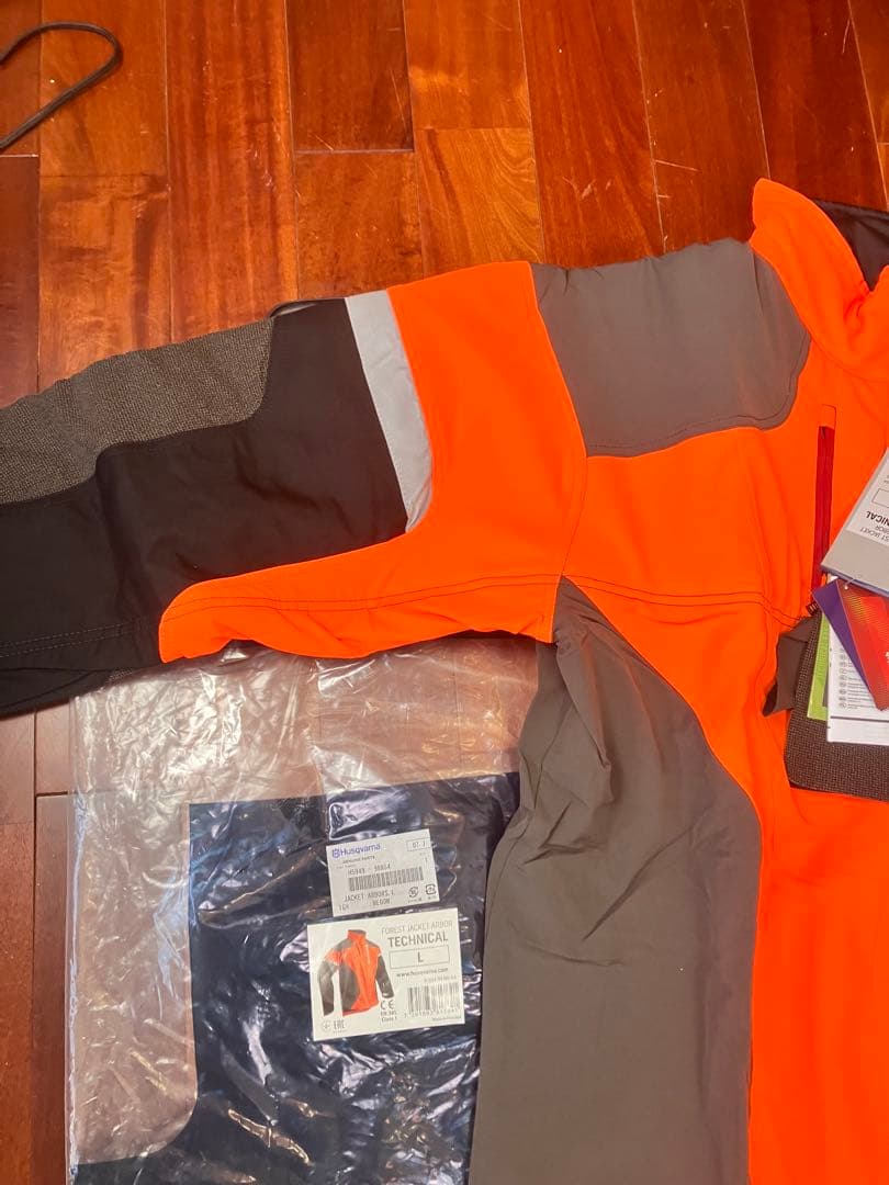 新品　Husqvarna テクニカルジャケットLサイズ オレンジ　おまけ付き