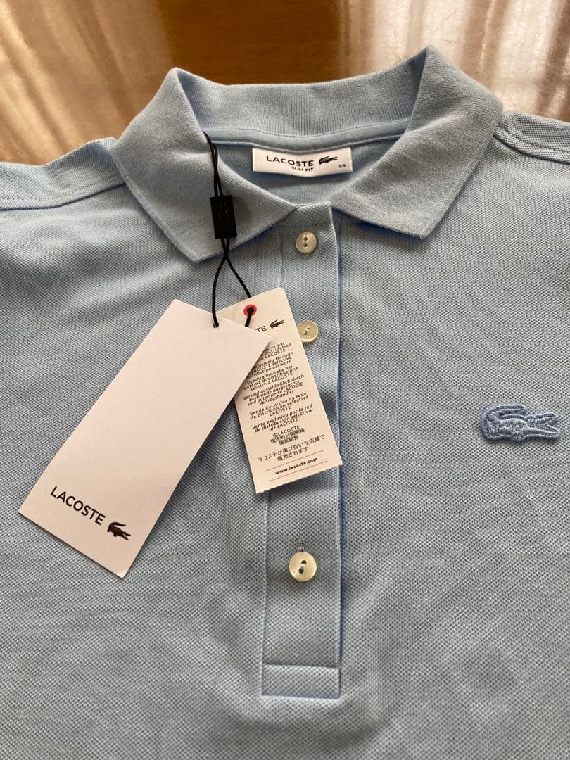新品未使用品LACOSTE ライトブルーポロシャツ PF5462L size36