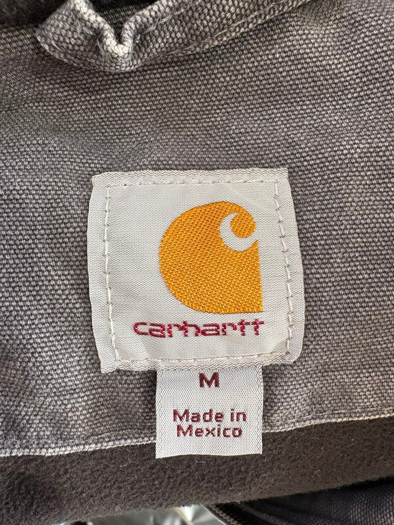 トップス tomonini