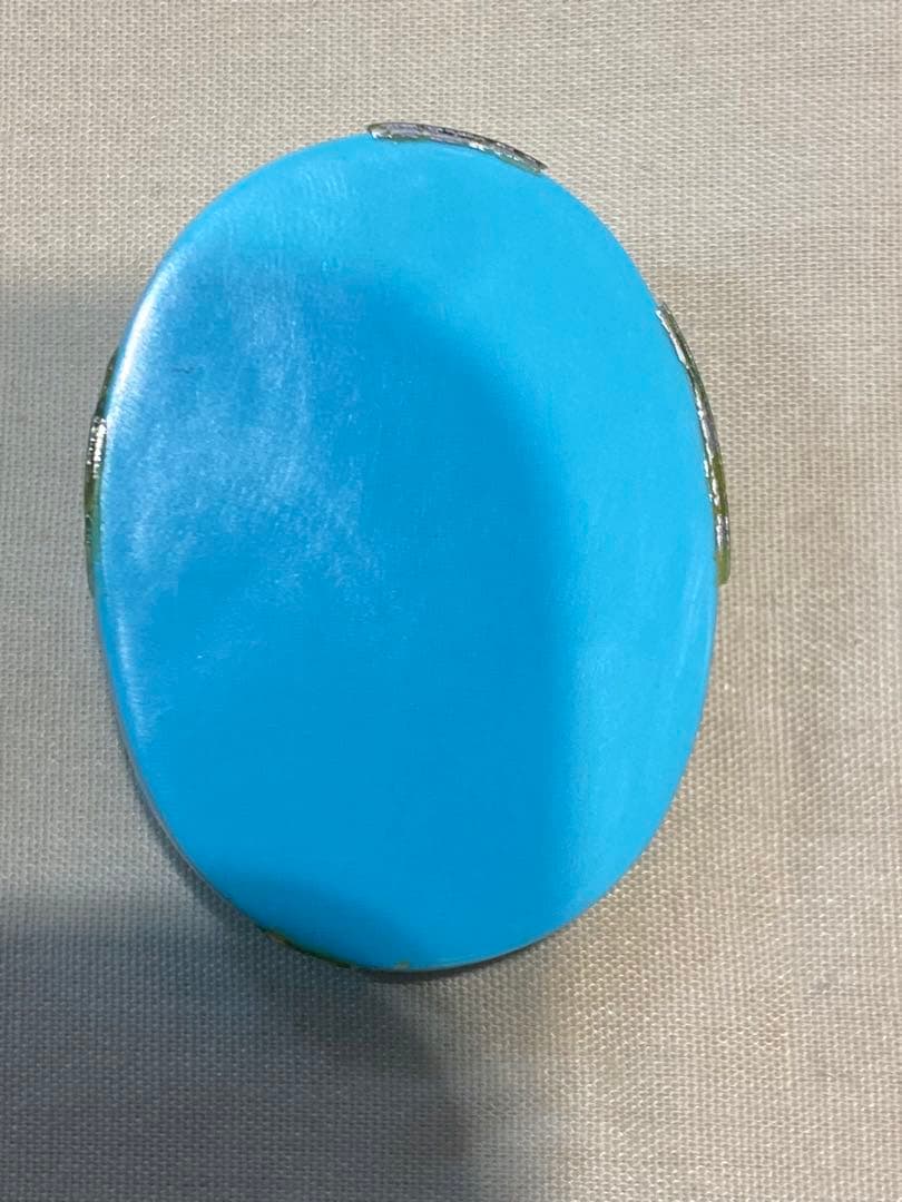 青色の彫刻 顔デザイン 楕円形