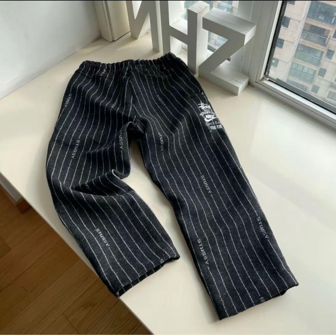 ステューシー × ナイキ ストライプ ウールパンツ ブラック