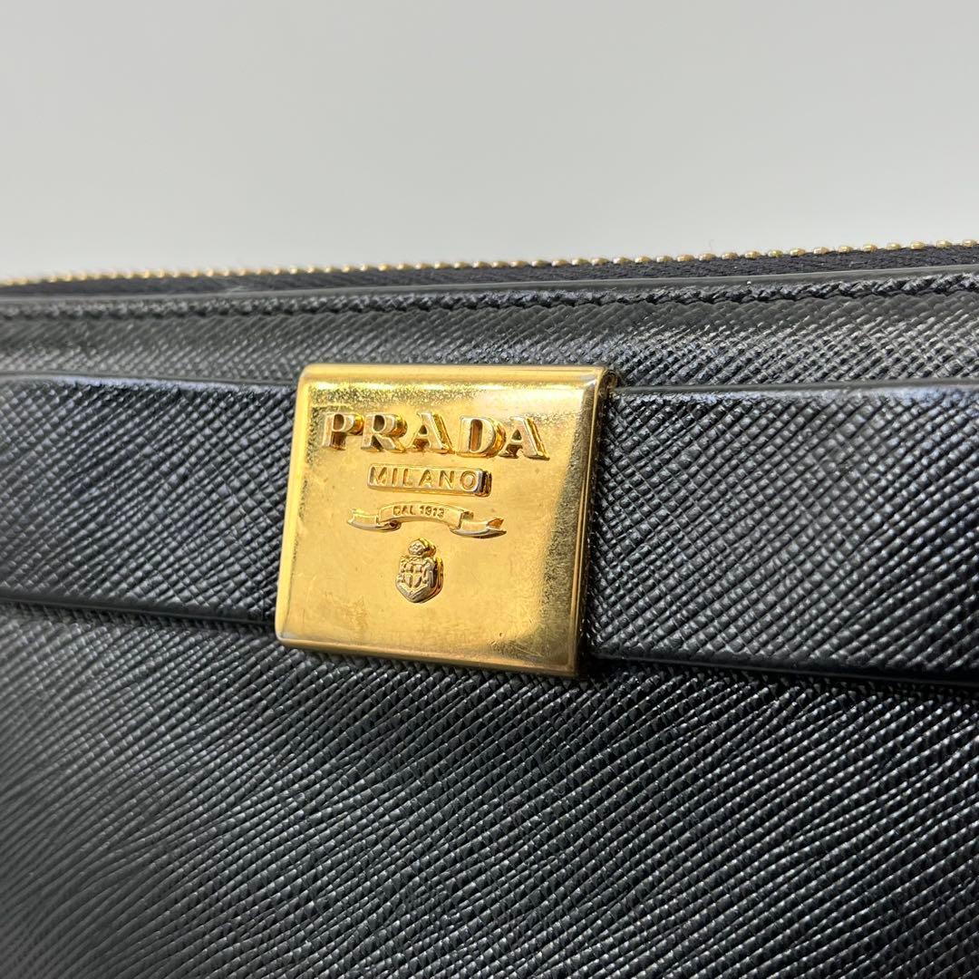 PRADA 長財布 ラウンドファスナー ロゴ金具 リボン サフィアーノレザー 黒