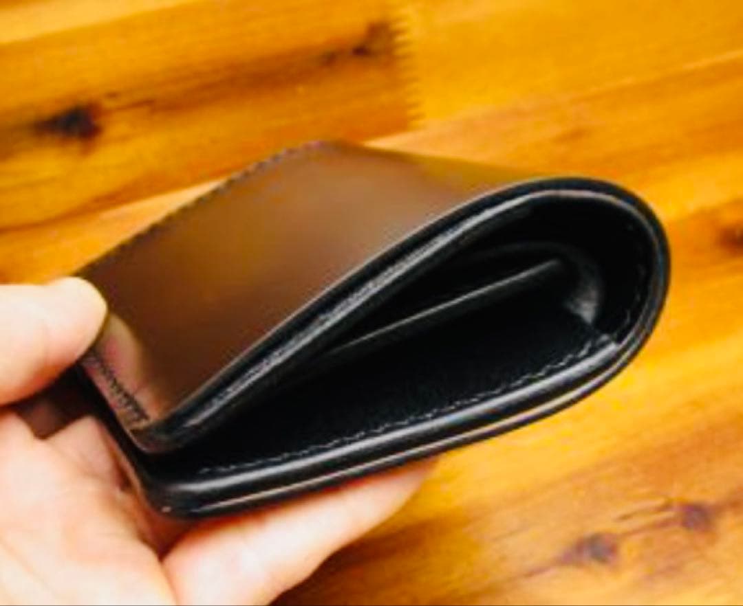 か*ん様 世界に１つ❗️新喜皮革 コードバン ブラック 黒 手縫い 二つ折り 栃