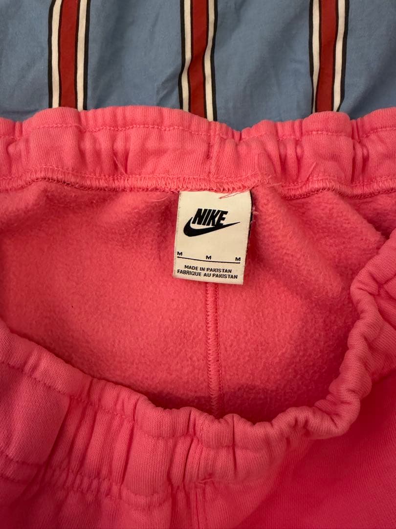 STUSSY NIKE ピンク スウェットパンツ