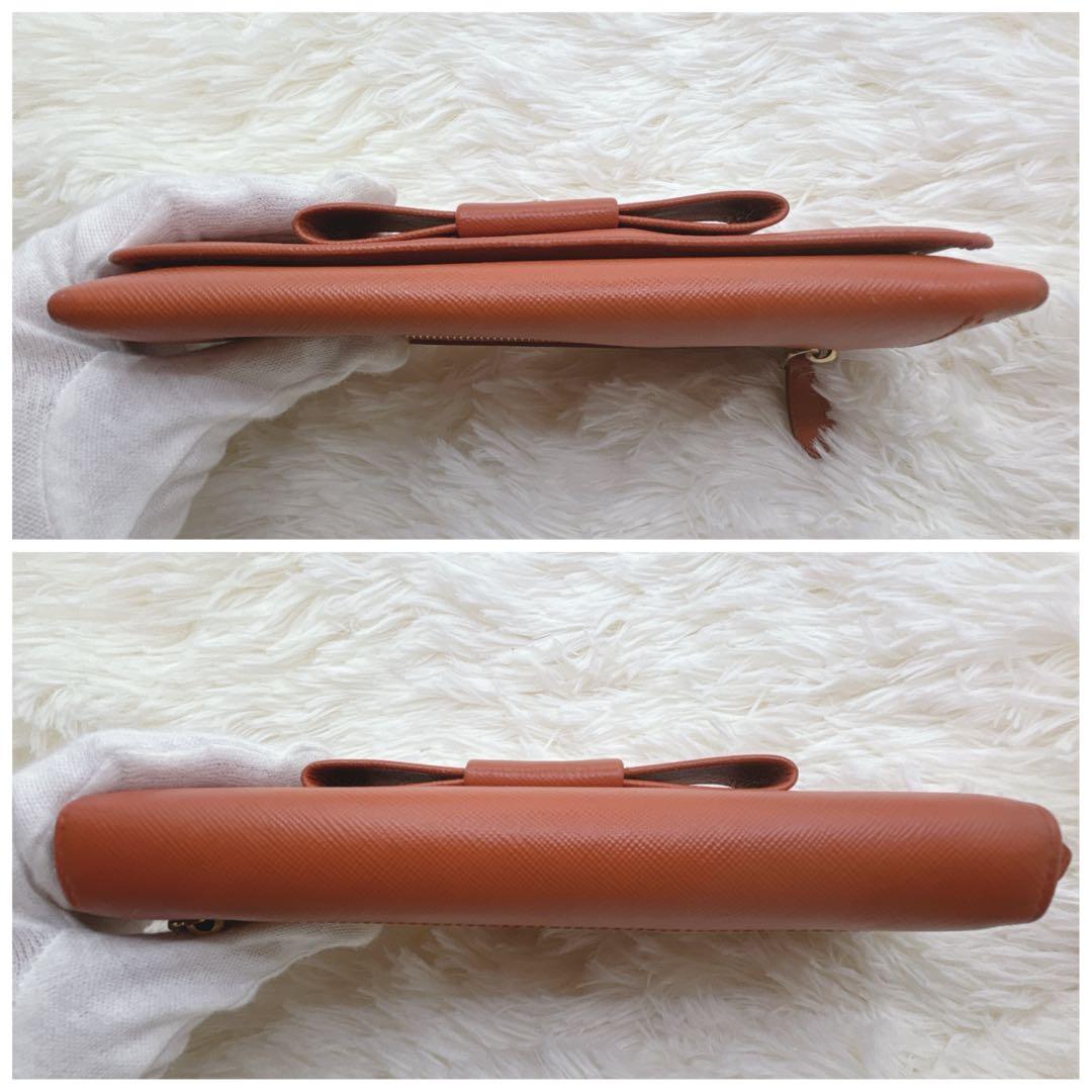 プラダ 長財布 サフィアーノ フィオッコ レッド メタルロゴ リボン