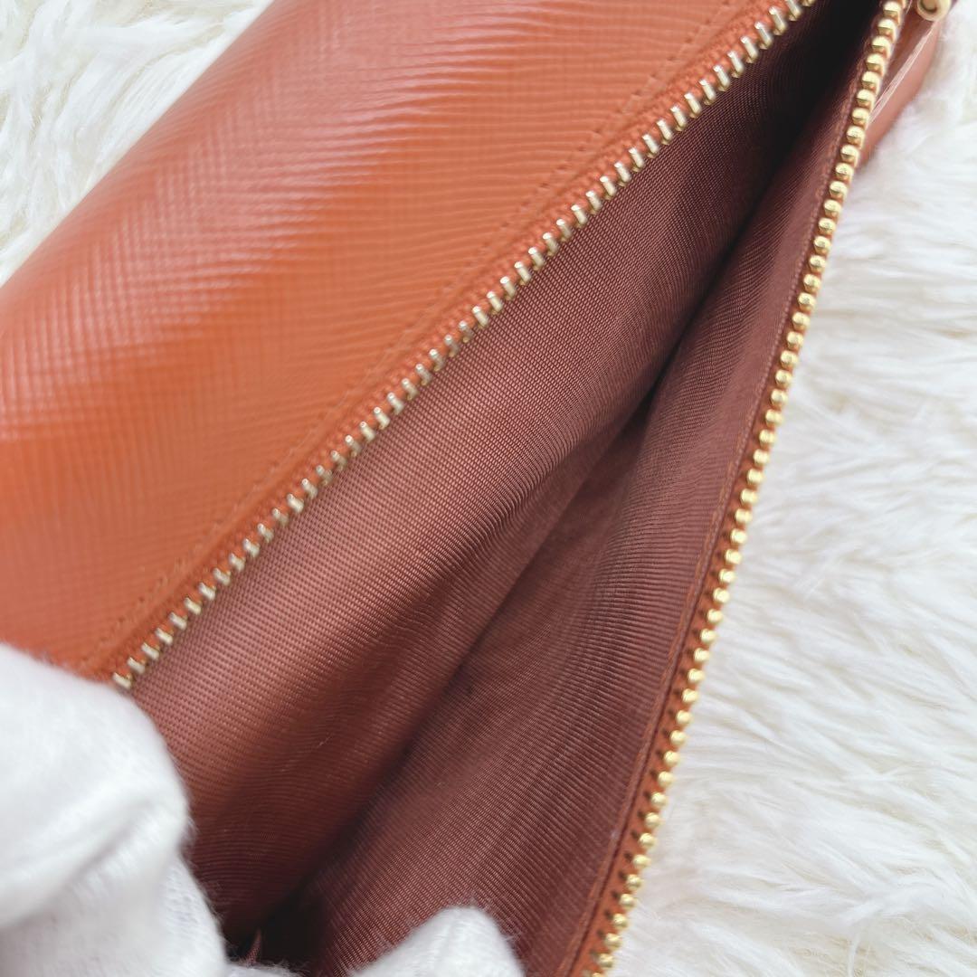 プラダ 長財布 サフィアーノ フィオッコ レッド メタルロゴ リボン