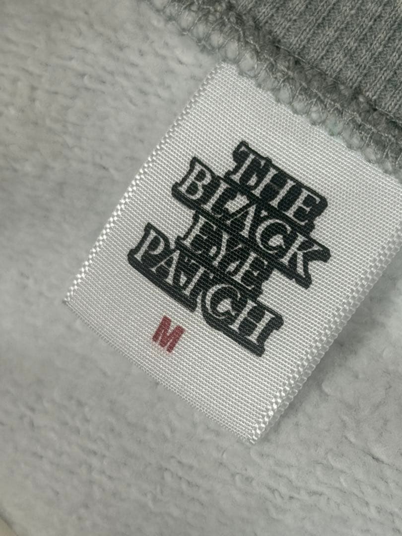 BLACK FUCKIN' EYE PATCH スウェット グレー