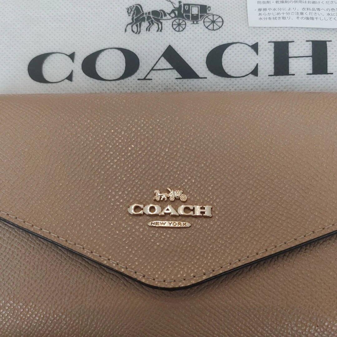 COACH ベージュ エンベロープ型長財布