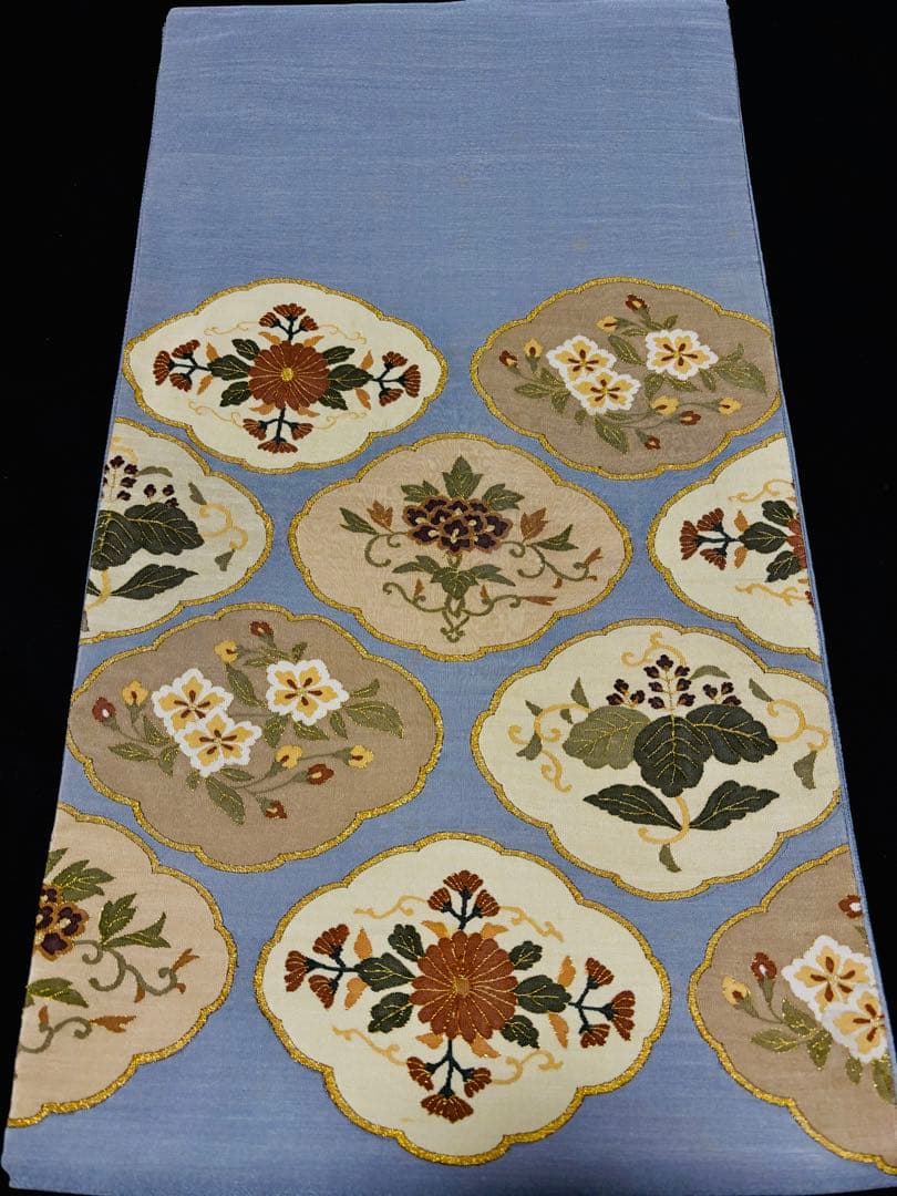 細かな明綴れ 青色 お太鼓柄