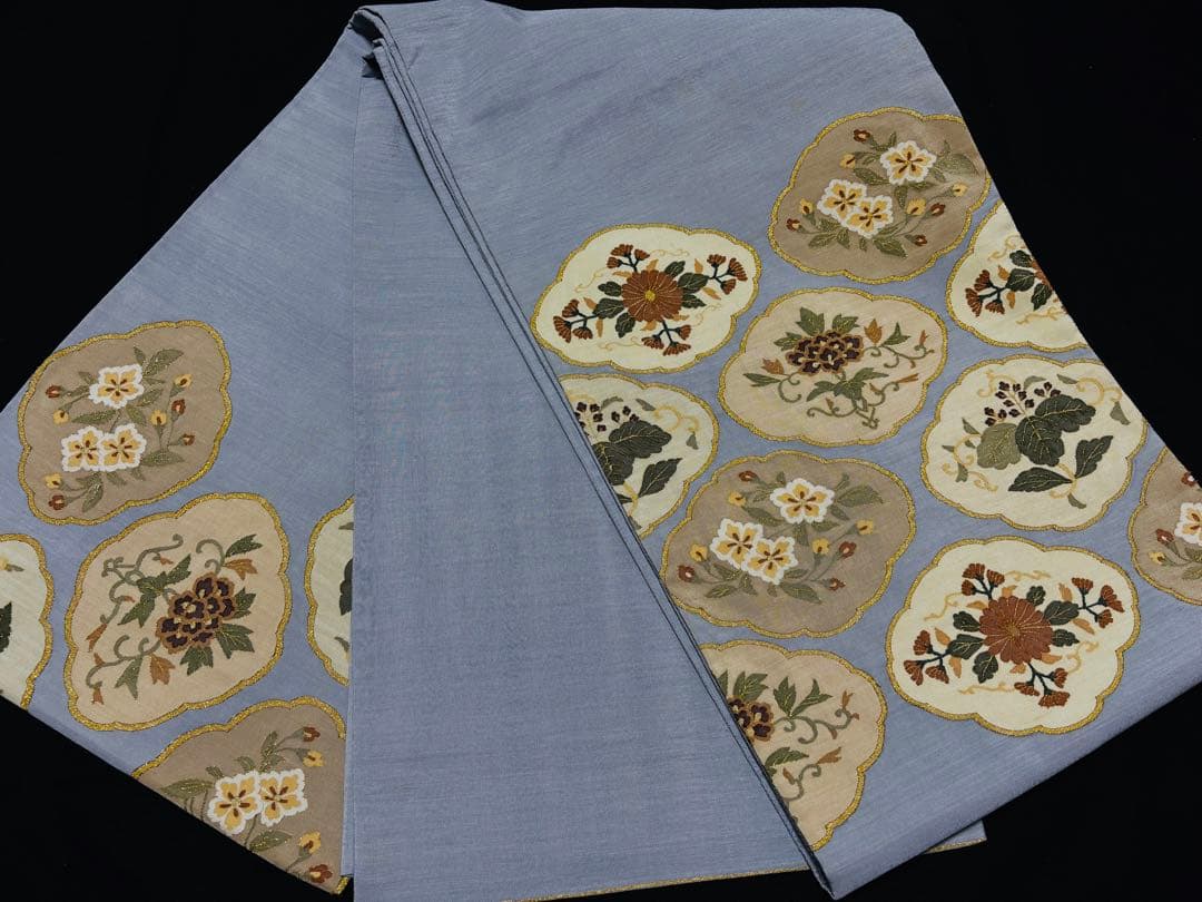 細かな明綴れ 青色 お太鼓柄