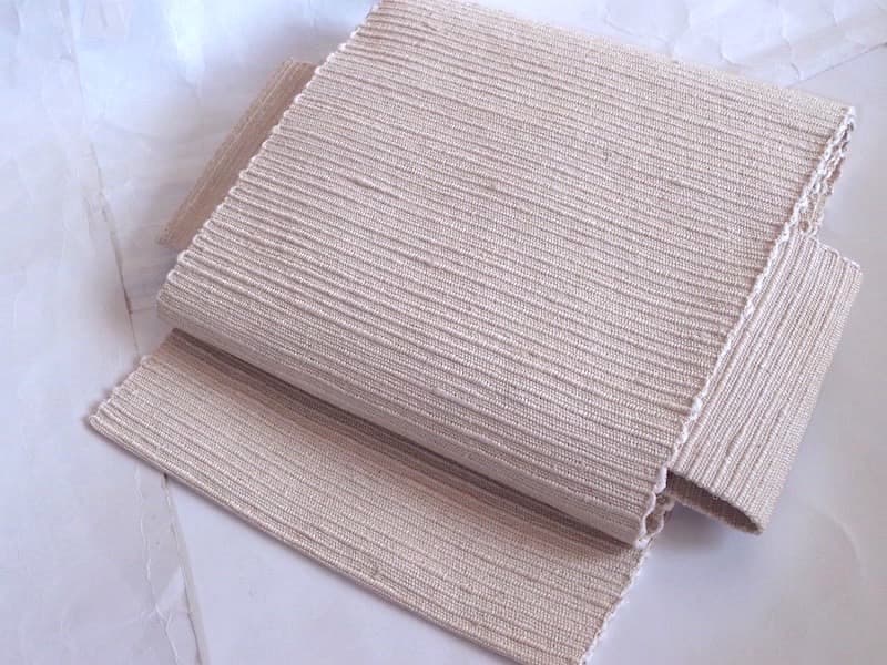 手織りの節紬八寸名古屋帯（オフホワイト無地）正絹美品