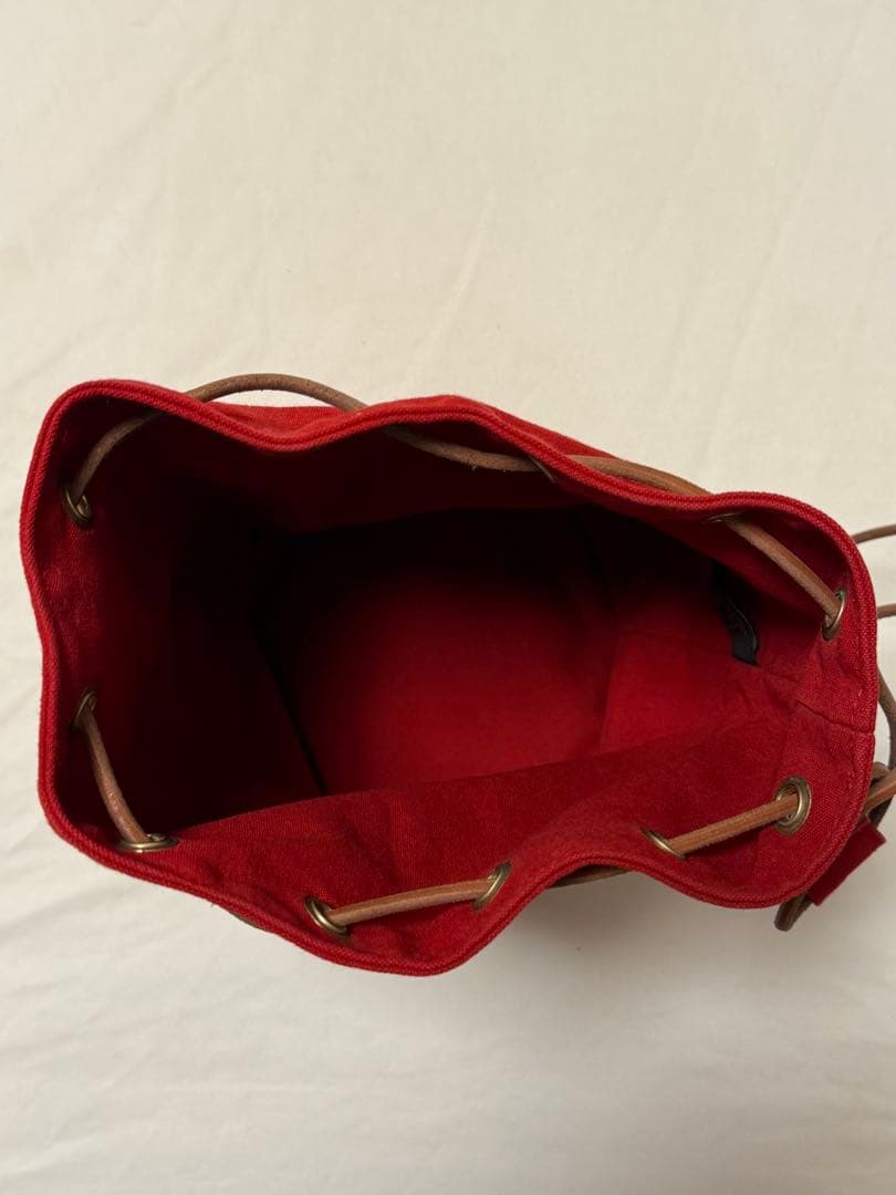 エルメス 赤 キャンバス ドローストリングショルダーバック