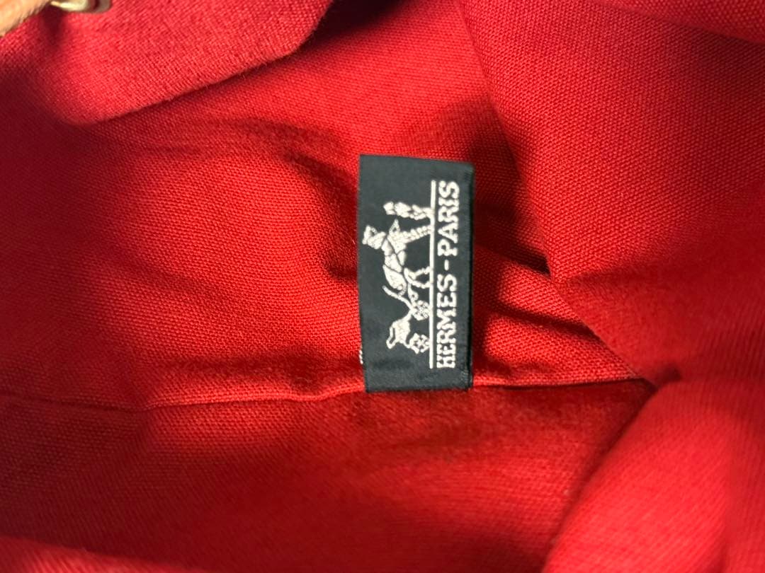 エルメス 赤 キャンバス ドローストリングショルダーバック