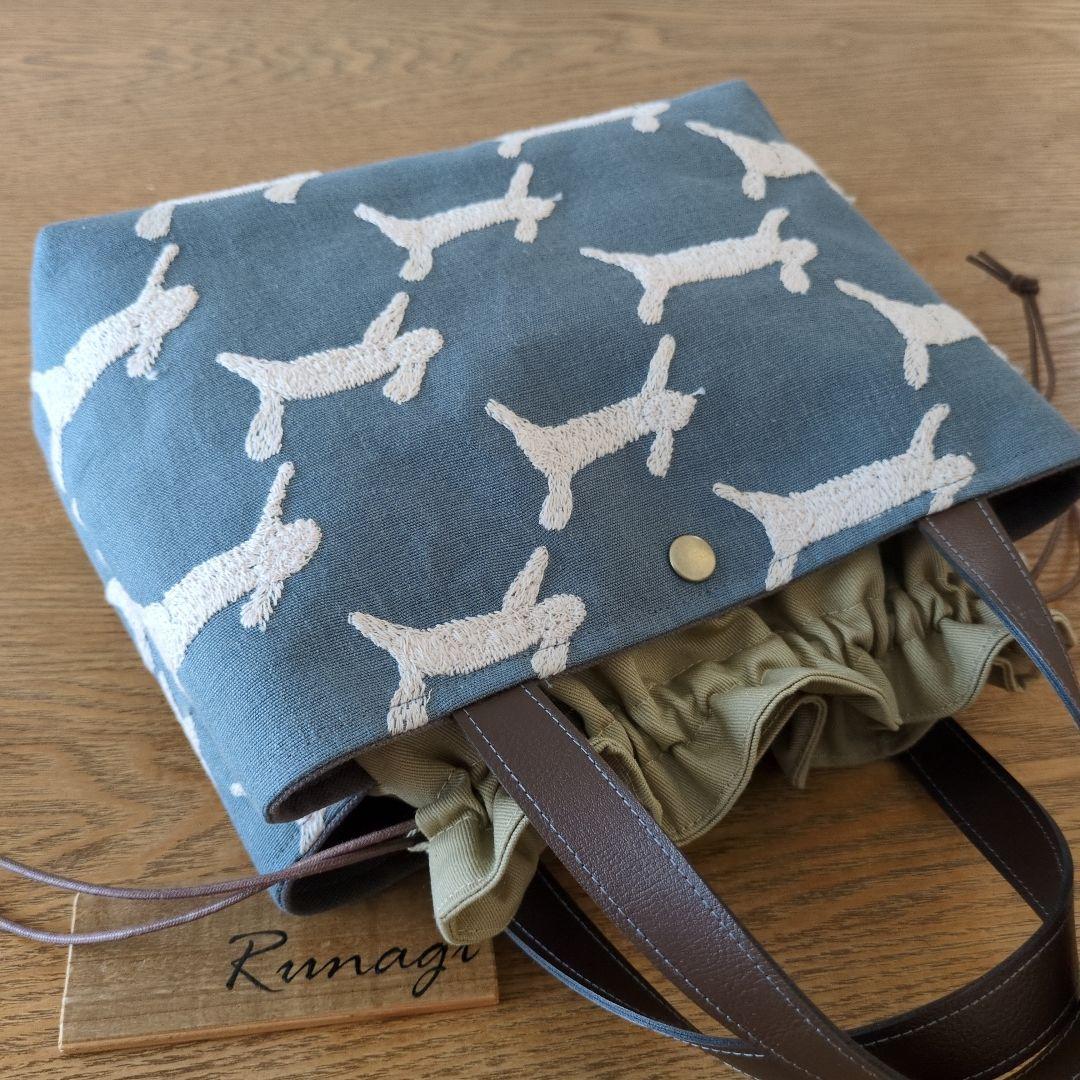 【1569】あおりポケットの巾着バッグ＊ミナペルホネン