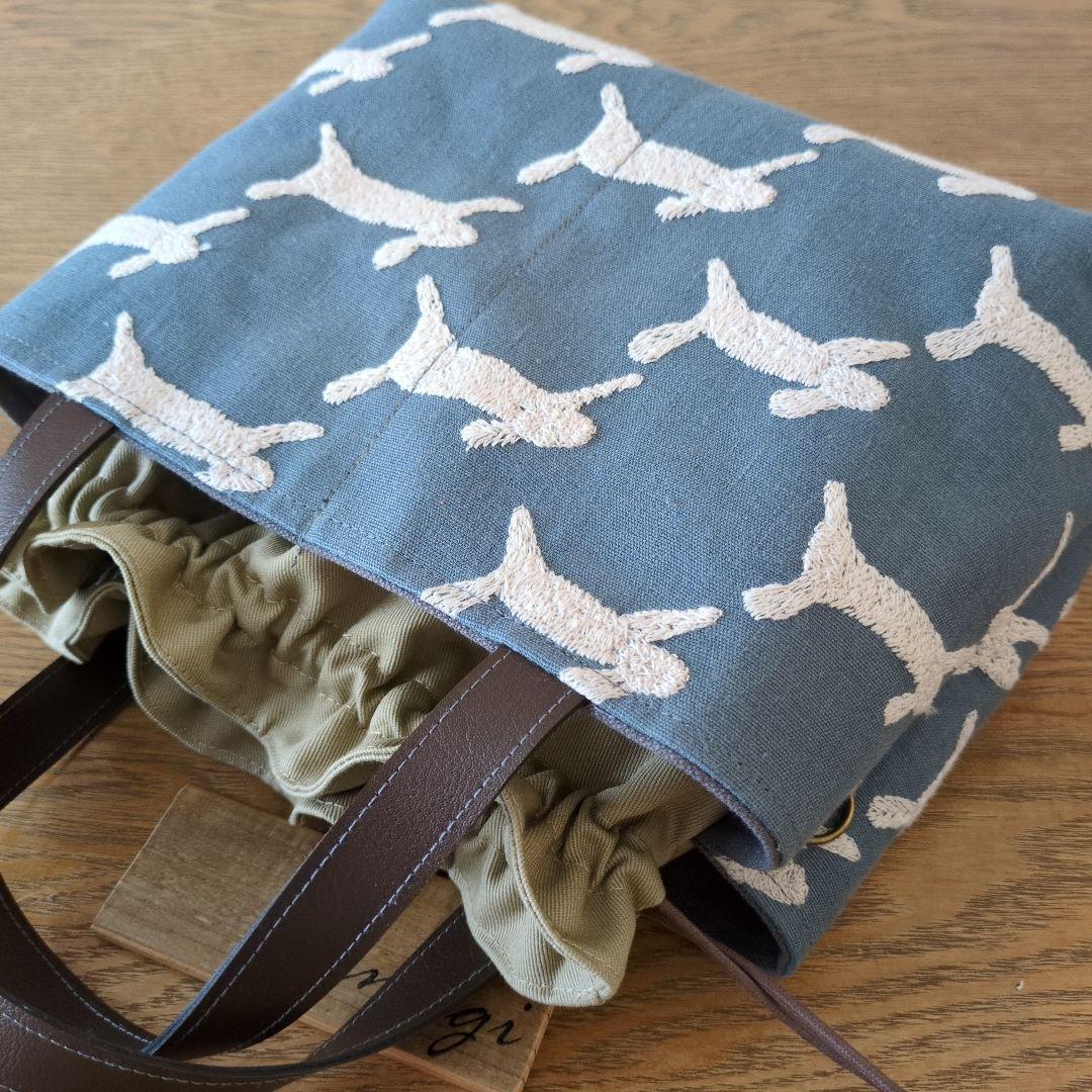 【1569】あおりポケットの巾着バッグ＊ミナペルホネン