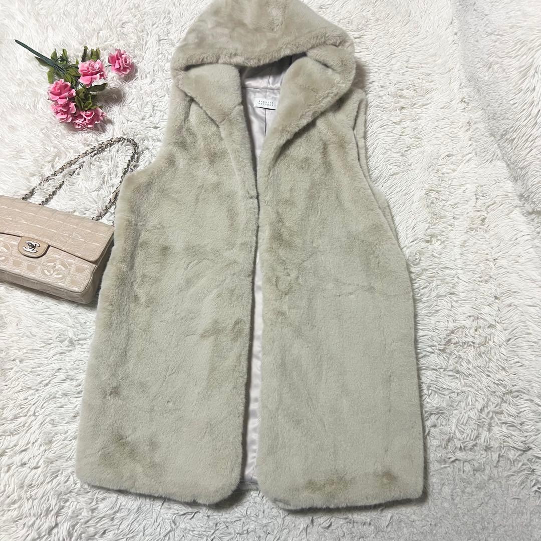 【SALE】バーニーズニューヨーク フェイクファーベスト フード ロングジレ