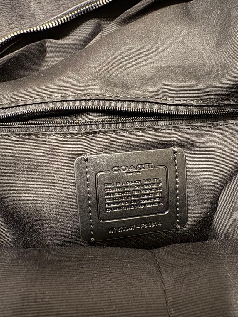 未使用・保存袋・説明書・ストラップ付き　COACH ブラック リュック