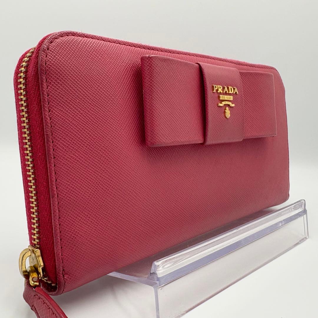 【美品】PRADA 長財布 ラウンド リボン メタルロゴ サフィアーノレザー