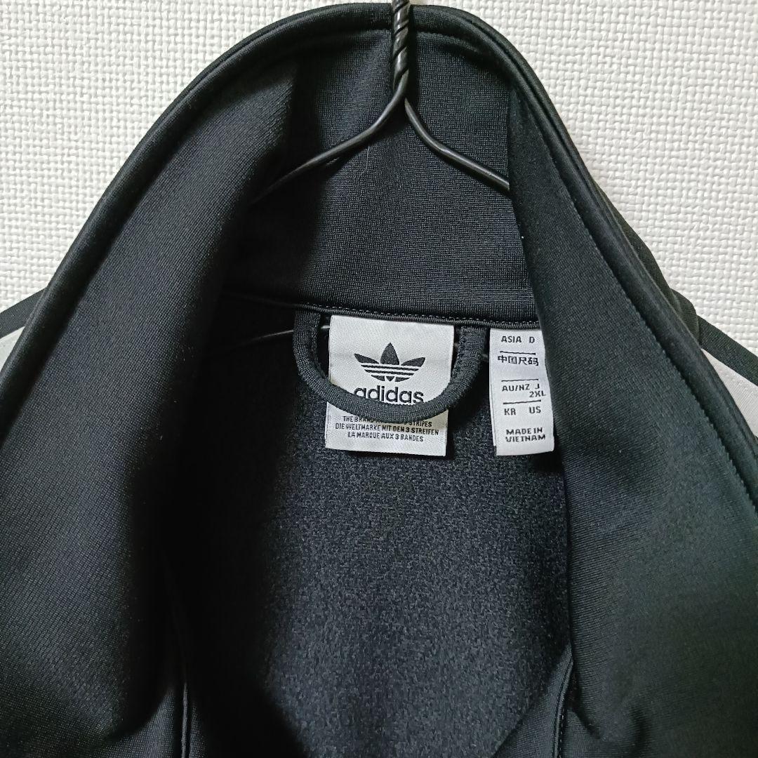 アディダス 黒 ファイヤーバード 襟高 トラックトップ ジャージ女性XL人気短丈