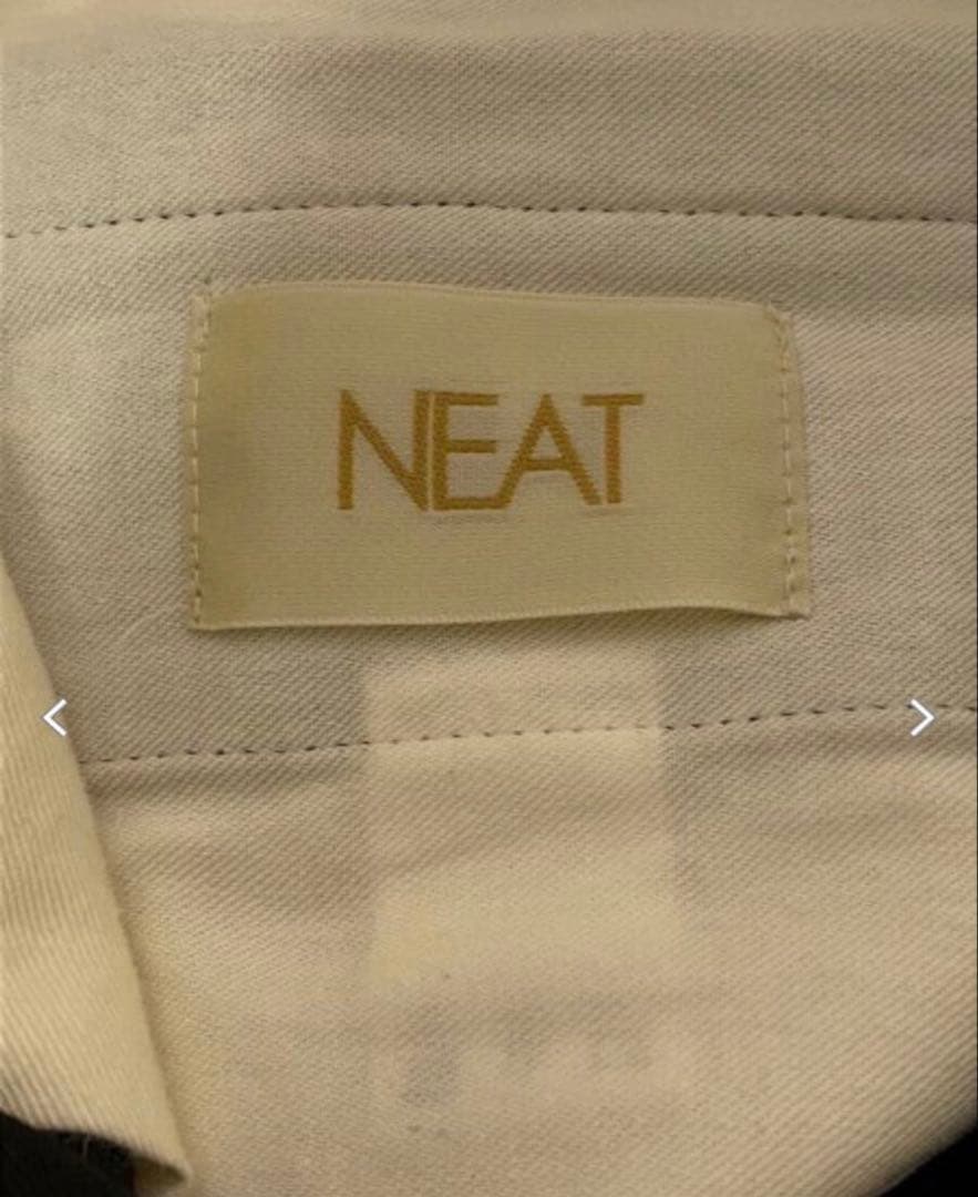 NEAT ブラック テーパードスラックス