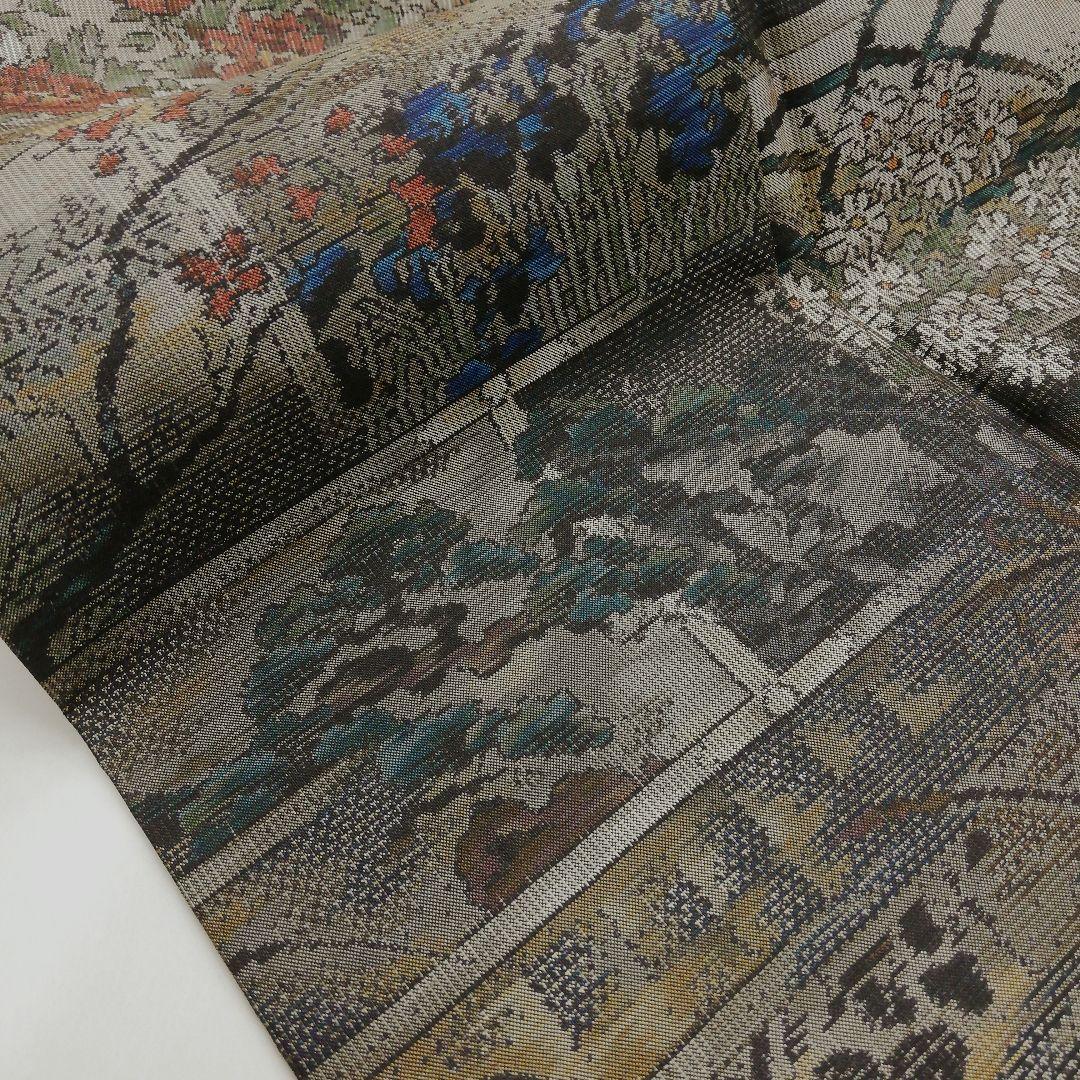 本場大島紬(袷)　(四季の草花紋様　恵 積五郎(絣の魔術師)　裄68㌢身幅広め)