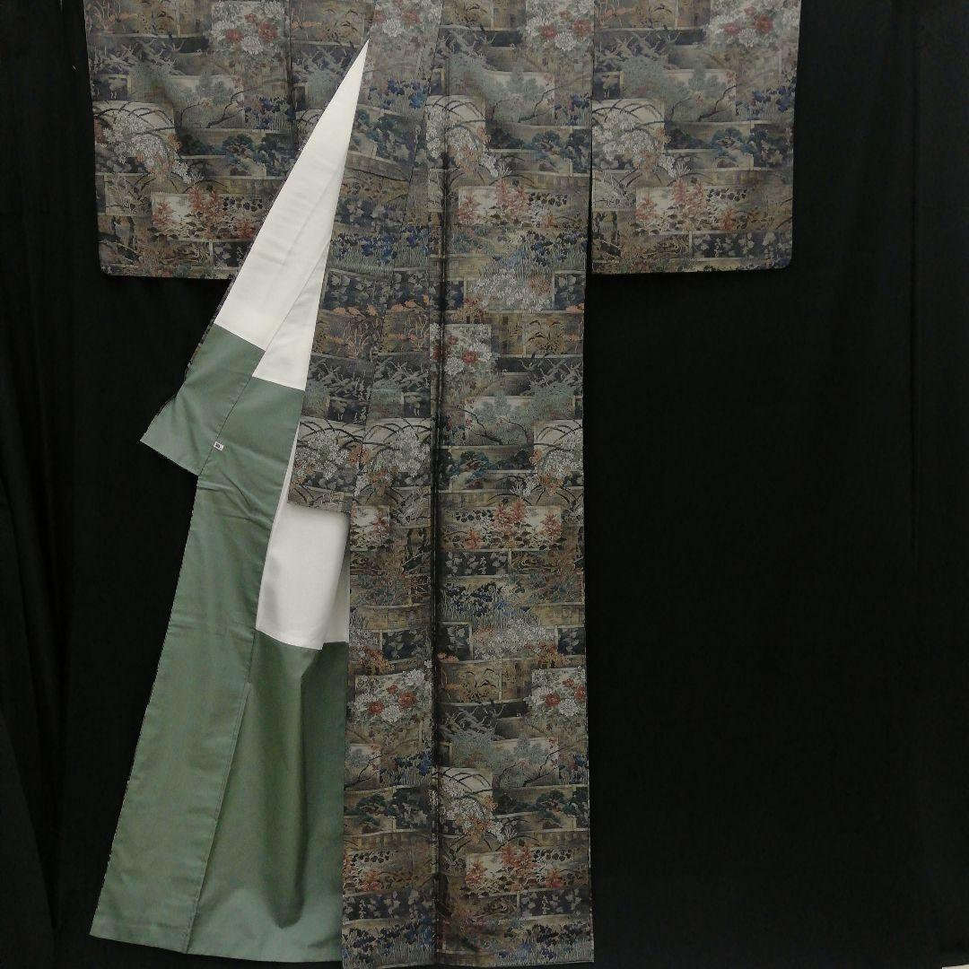 本場大島紬(袷)　(四季の草花紋様　恵 積五郎(絣の魔術師)　裄68㌢身幅広め)