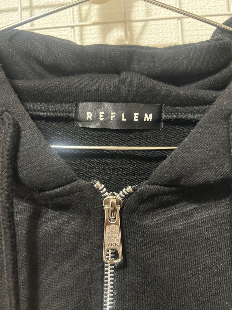 レフレムラインストーンクロス総柄長袖ジップアップパーカー