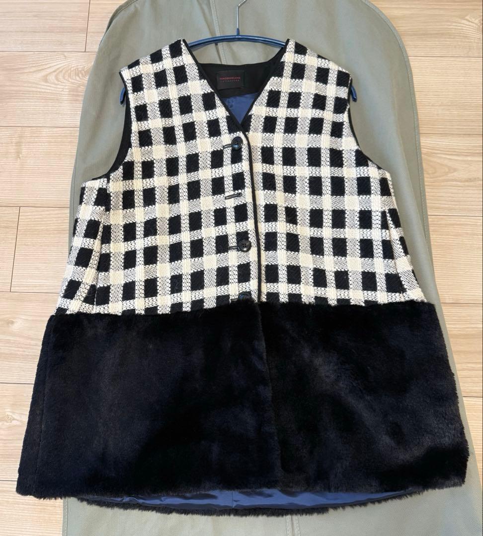 TOMORROWLAND 　タッタ—シェパード ファーペプラムジレ