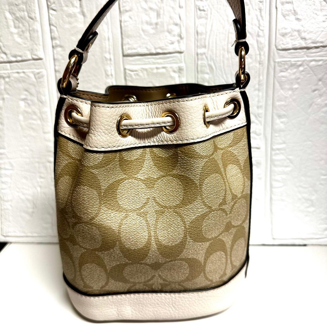 n*o様 【美品】コーチシグネチャー コーテッド キャンバス、リファインド ペブ