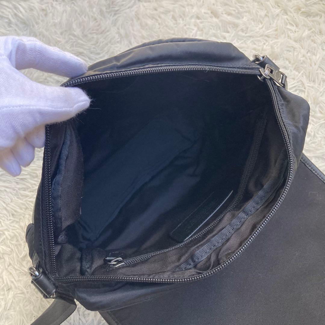 COACH フライトバッグ 黒 ブラック パンチング レザー 革 バックル