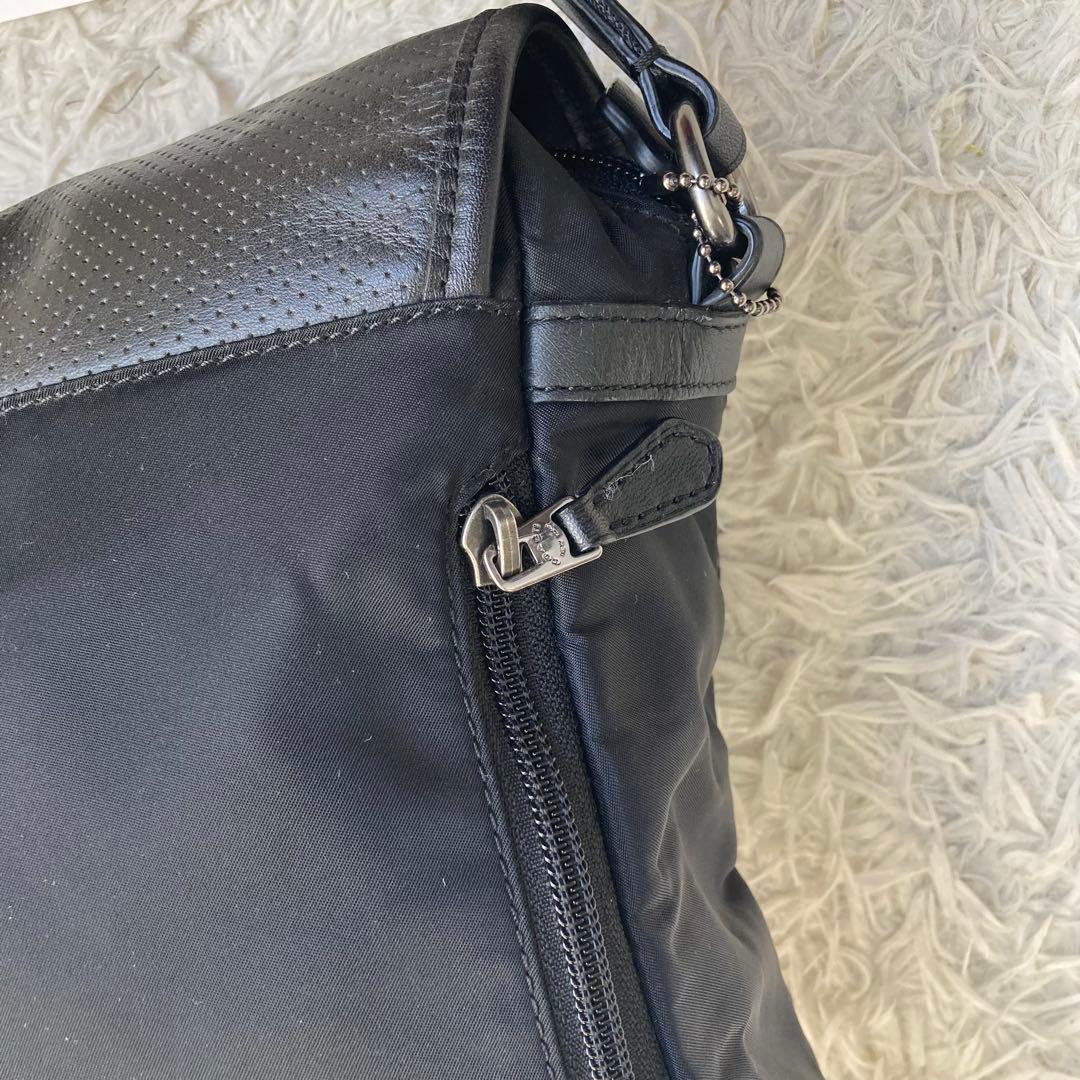 COACH フライトバッグ 黒 ブラック パンチング レザー 革 バックル