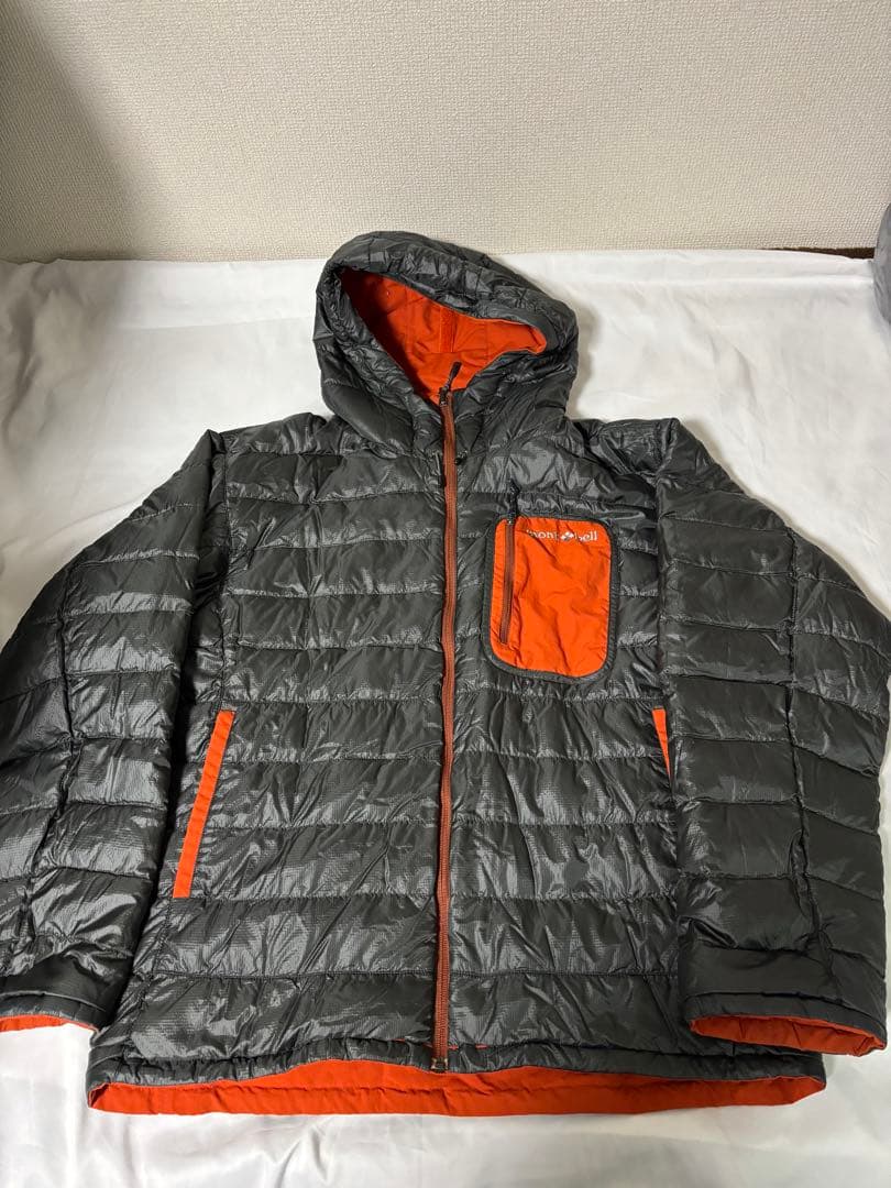人気モンベル725FP コロラドパーカ　メンズLリバーシブルダウンオレンジグレー