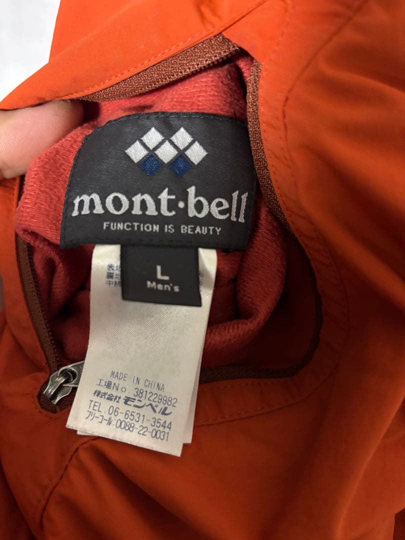 人気モンベル725FP コロラドパーカ　メンズLリバーシブルダウンオレンジグレー
