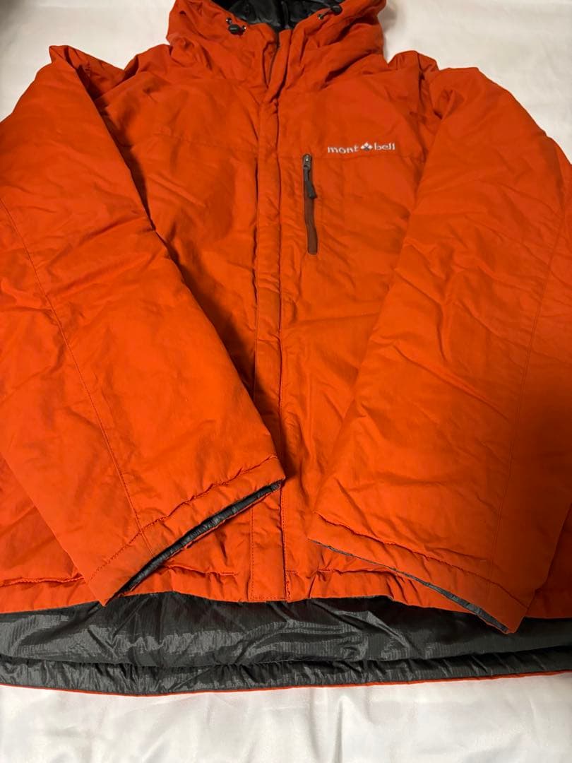 人気モンベル725FP コロラドパーカ　メンズLリバーシブルダウンオレンジグレー