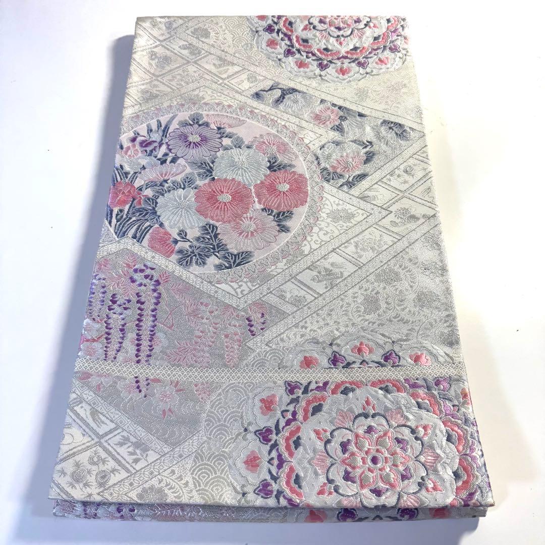 5k2780 袋帯　絹　唐織　プラチナ箔　正倉院文様　華文　銀色　白　ピンク　紫